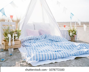 Bohemian Style Outdoor Picnic. Bright Scene Of Romantic Beach Dining.