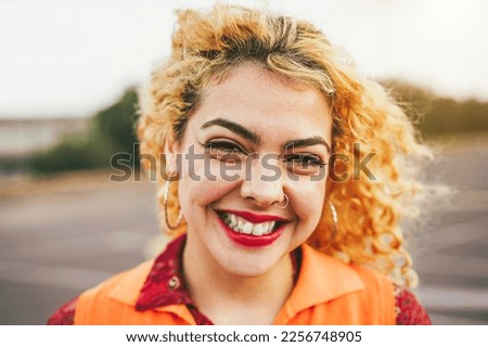 Bohemian young girl smiling on camera outdoor - Main focus on eyes
