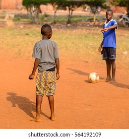 BOHICON, BENIN - JAN 11, 2017: Unidentified Beninese Children Play Football With Bare Feet. Soccer Is Very Popular Game Among The  African Kids