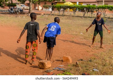 BOHICON, BENIN - JAN 11, 2017: Unidentified Beninese Children Play Football With Bare Feet. Soccer Is Very Popular Game Among The  African Kids