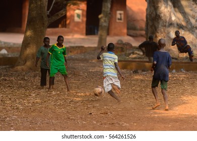 BOHICON, BENIN - JAN 11, 2017: Unidentified Beninese Children Play Football With Bare Feet. Soccer Is Very Popular Game Among The  African Kids