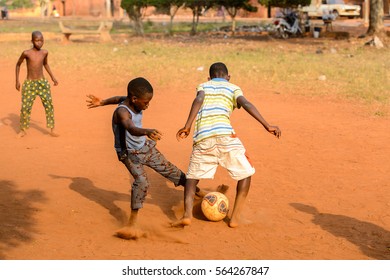 BOHICON, BENIN - JAN 11, 2017: Unidentified Beninese Children Play Football With Bare Feet. Soccer Is Very Popular Game Among The  African Kids