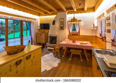 Bohinj, Slovenia - July 11 2020: Chalet Wooden Guest House Wood Burning Stove Interior.