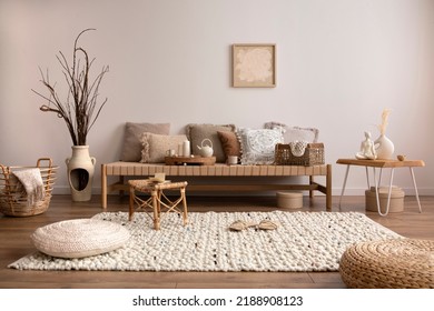 Boho And Cozy Interior Of Meditation Room With Beige Chaise Lounge, Carpet, Rattan Pouf, Pillows, Side Table, Decoration, Books And Personal Accessories. Warm Home Decor. Template. 