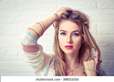 Boho Girl Portrait at White Brick Wall Background - Powered by Shutterstock