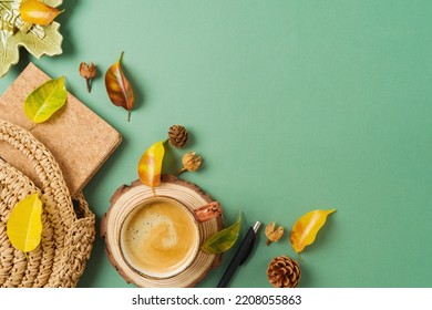 Boho Home Office Workplace. Coffee Cup, Planner, Bag And Autumn Leaves On Green Background. Top View, Flat Lay