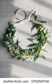 Boho style bride head piece from fresh flowers: white wax flower, goldenrod and ruscus leaves. Bridal greenery crown for a modern rustic wedding. Woman's natural accessory.    