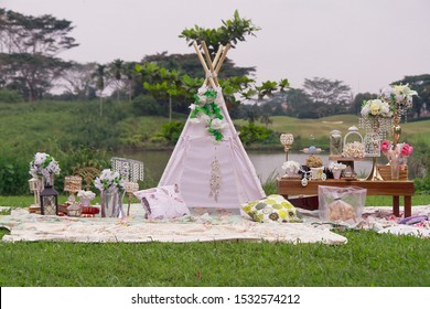 Boho style decoration with teepee tent, flowers, pillow and other accecories