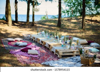 
Boho Style Party Decor In The Forest. Party Decoration For A Bachelorette Party. Furniture From Pallets