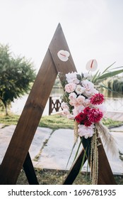 Boho Style Wedding Arch With Decor And Flowers
