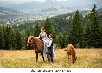 Boho style wedding. Beautiful and stylish couple bride and groom on a  horse farm. 