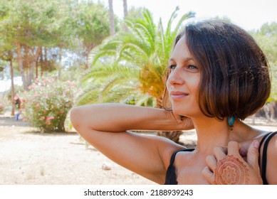 Boho Style Woman Portrait With Mehndi Hand.