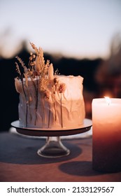 Boho Wedding Cake On The Table In The Evening