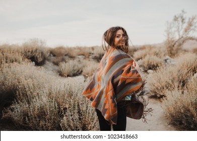 Boho Woman With Windy Hair. Hipster Girl In Gypsy Look, Young Traveler In The Desert Nature.