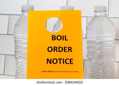 Boil order notice and bottled water. Clean, contaminated, dirty or broken drinking water supply concept. - Shutterstock ID 2084244025