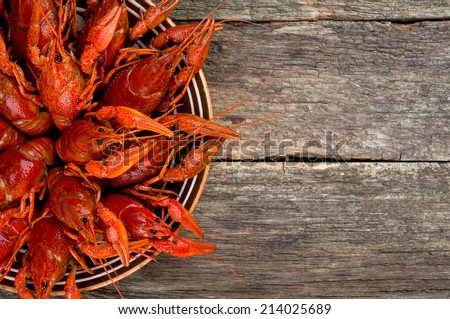 boiled crawfish on wooden surface