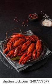 boiled crayfish on a black plate. High quality photo
