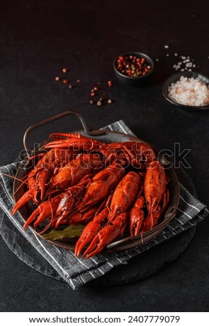 boiled crayfish on a black plate. High quality photo