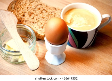 Boiled Egg Breakfast With Toast, Butter And Coffee