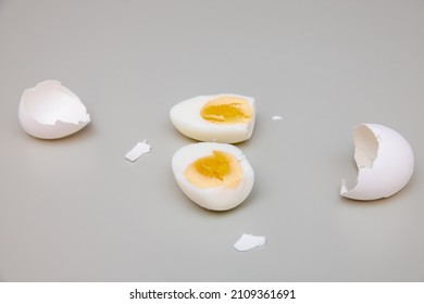 Boiled egg cut in half with egg shells
