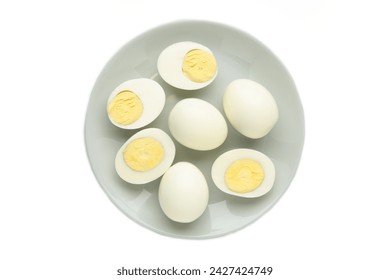 Boiled eggs on plate isolated on white background. Top view - Powered by Shutterstock