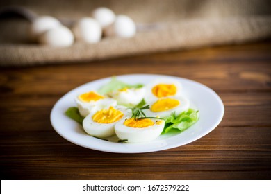 Boiled Eggs With Salad Leaves In A Plate