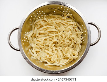 Boiled noodles in a colander for cooking. - Powered by Shutterstock