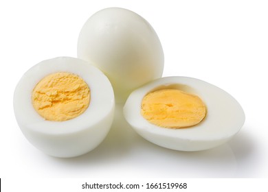 boiled peeled eggs on a white background, one whole egg two eggs are cut in half, the yolk is visible, concept - Powered by Shutterstock