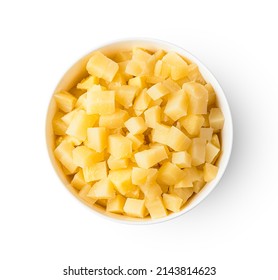 Boiled potatoes, diced in a bowl isolated on a white background. An ingredient for cooking a dish. Top view, close-up.