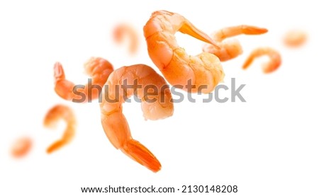 Boiled prawns levitate on a white background