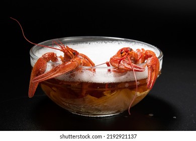 Boiled red crayfish - an appetizer bathed in beer like in a sauna or bubble bath, creative funny photo