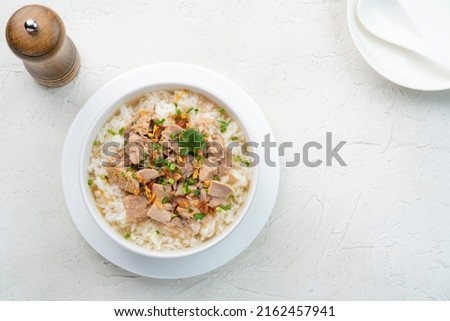 Boiled rice with canned tuna fish,Thai rice soup,Fusion Asian breakfast style.Top view