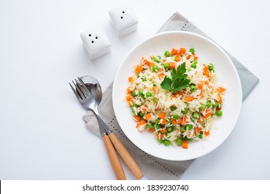 Boiled Rice With Vegetables On A Plate, Traditional Asian Dish, Top View