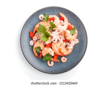 Boiled Shrimps Or Prawns And Small Octopuses With Herbs On A Blue Ceramic Plate Isolated On White Background. Top View, Flat Lay, Close Up.