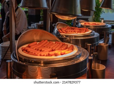 Boiled Skinless Sausage Served In Stainless Steel Buffet Utensils