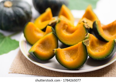 Boiled slice Japanese pumpkin on a plate ready to eating, Healthy vegan food