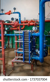 Boiler Room Of An Apartment Building With Pipes And Metering Devices