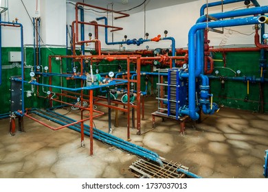 Boiler Room Of An Apartment Building With Pipes And Metering Devices