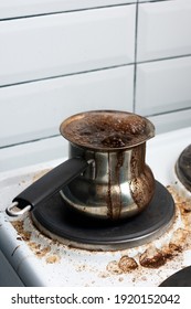 Boiling Coffee In A Turkish Coffee Maker On The Stove, Dirty Stove, Side View, Vertical