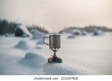 Boiling Tea In A Titanium Mug On A Gas Burner