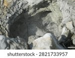 Boiling thermal mud bubbles inside an active volcanic vent.