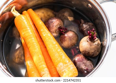 Boiling Vegetables In A Big Cooking Pot To Make A Vinaigrette Salad.