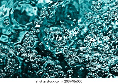 Boiling Water Bubbles. Air Bubble Background. Fizzy Water Texture. Black Water Pattern. Dark Wet Background. Turqoise Color Water Closeup.