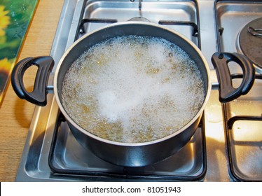 Boiling Water Inside A Kitchen Iron Pot