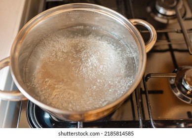 Boiling Water Inside A Pot.Kitchen Iron Pot,top View,selective Focus.