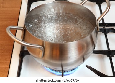 Boiling Water Into Saucepan On Gas Stove