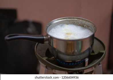 Boiling Water In A Kitchen Pot As A Symbol Of Cooking Or Food Preparation And Sterilization Of Contaminated Tap Water For Healthy Pure Drinking Liquid 
