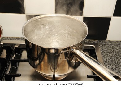 Boiling Water On A Stove In The Kitchen