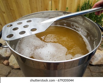 Boiling Wort During Beer Brewing With A Stirring Paddle