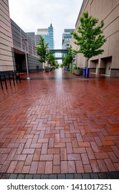 Boise, ID, USA - May 25, 2019: City Sidewalk Made Of Bricks Lined With Trees 